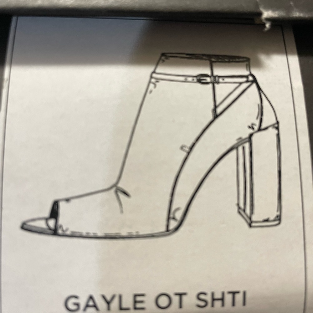 Black leather shoes with open toe.